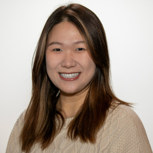 PhD Student Yutong (Vicky) Jiang smiles at the camera in front of a white background