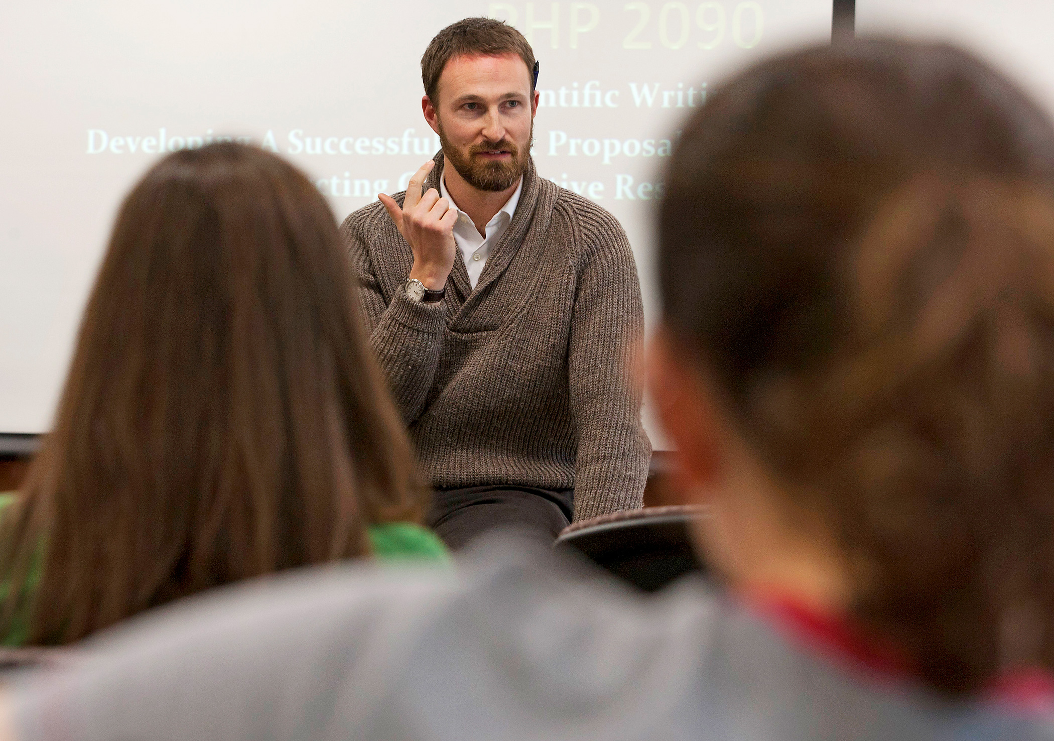 Professor Eric Loucks addresses a class of students at Brown.